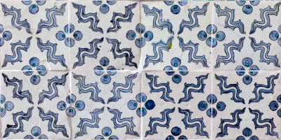 Eight tiles: four across, two deep. All the tiles have an identical pattern. The pattern repeats at the intersections.